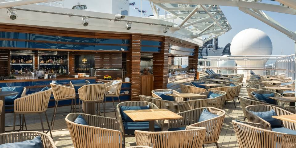 The MSC Yacht Club Grill & Bar is a dedicated outdoor terrace where guests can savour meals and drinks all day long.