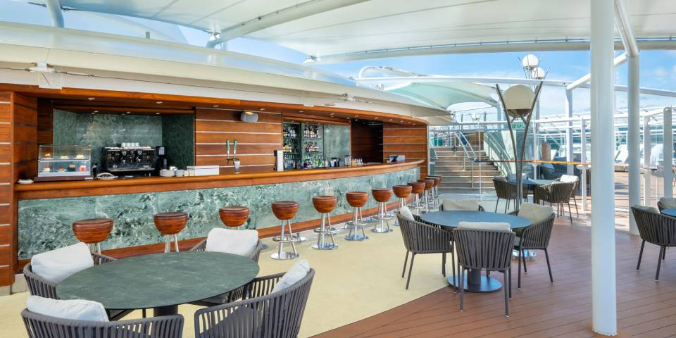 The MSC Yacht Club Grill & Bar is a dedicated outdoor terrace where guests can savour meals and drinks all day long.