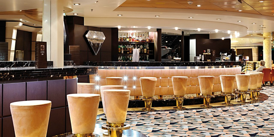 The Golden Bar is the ship's second pre-dinner cocktail lounge and offers live entertainment to see you into the night. The perfect spot for relaxing with your favourite drink or cocktail after a day of exploring all that the ship has to offer