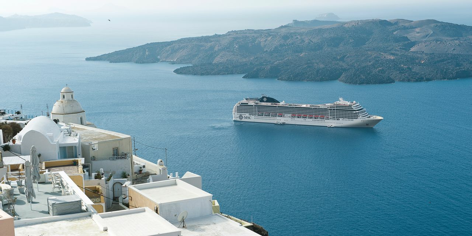 MSC Musica in Santorini, Greece. Famous for its red beach, sheer cliffs, white-washed houses and turquoise Aegean Sea