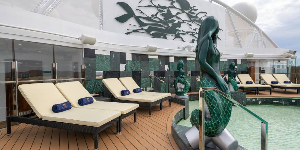 The MSC Yacht Club Sundeck & Pool is an exclusive luxurious outdoor area with captivating swimming pool, spacious sundeck, and relaxing large hot tubs for an remarkable luxury cruise experience.