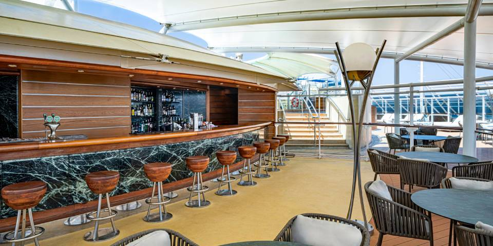 The MSC Yacht Club Sundeck & Pool is an exclusive luxurious outdoor area with captivating swimming pool, spacious sundeck, and relaxing large hot tubs for an remarkable luxury cruise experience.